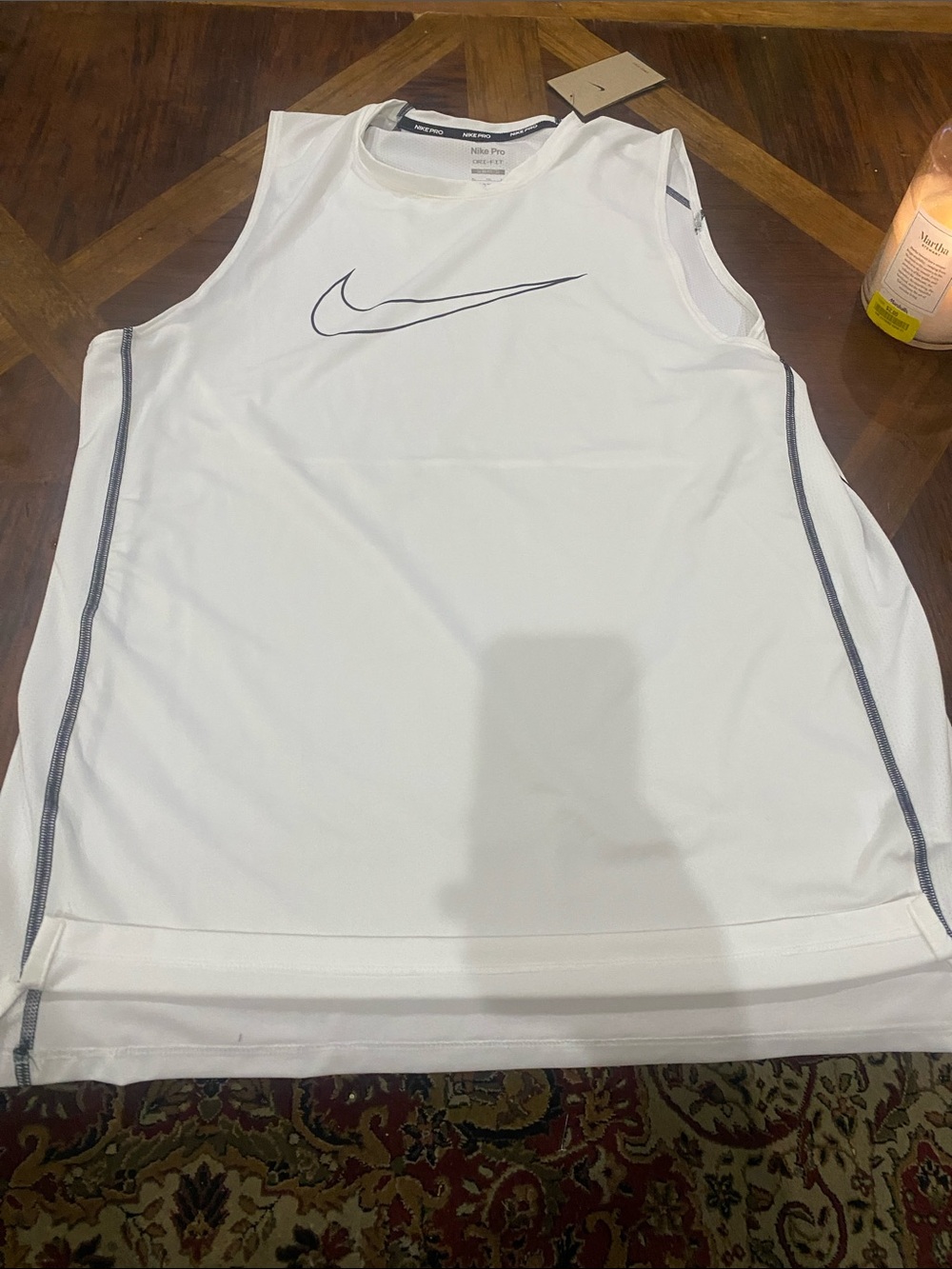 Nike White Sleeveless Athletic Tank with Black Swoosh